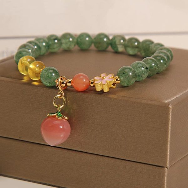 1693c6151ff69bbd9176a15ce7c35175.jpg green aventurine crystal bracelet flat lay photo