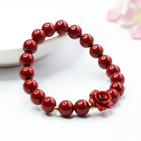cinnabar rose carving charm bracelet close up