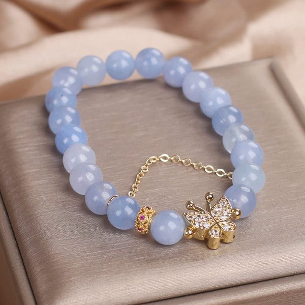 1728360175_10bddde0-04d2-4048-9842-3fbf41b1d802.jpg blue chalcedony communication bracelet flat lay product
