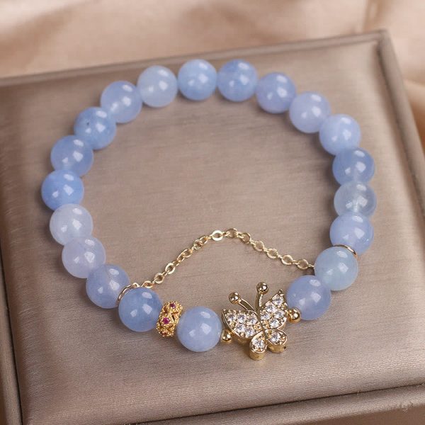 1728360175_a614aed8-962c-4738-9289-bac4c2127c08.jpg blue chalcedony calm bracelet soft blue tone side view