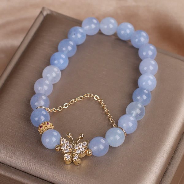 1728360175_f3c00dc1-a2c2-41ba-bc5e-e0b413fd2f96.jpg blue chalcedony bracelet crown charm pendant detail