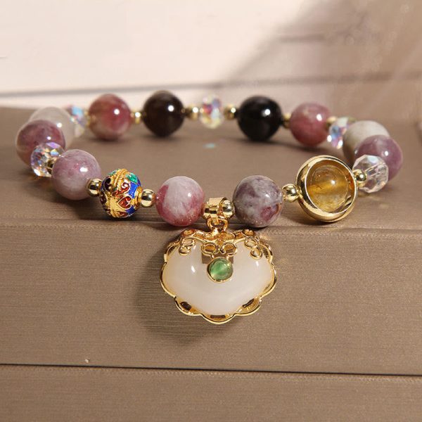 33a2bab2d7a1e70619662abfdc0b6e23.jpg strawberry quartz crystal bracelet flat lay photo