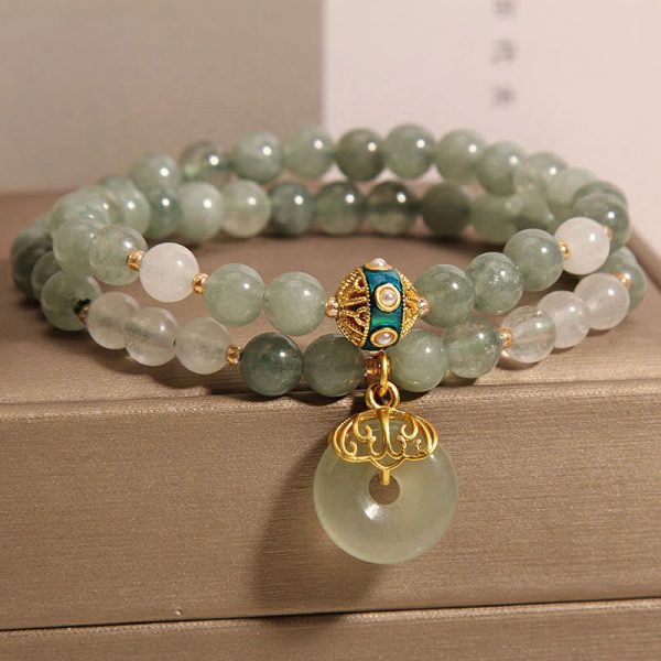 green jade crystal energy bracelet flat lay
