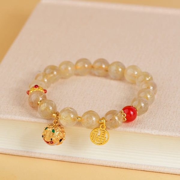 6825c70a1a2b0b2af075ce9f2f9606f7.jpg Golden Rutilated Quartz Crystal Bracelet – Natural Healing Gemstone Bead Bracelet for Wealth Attraction, Abundance & Manifestation