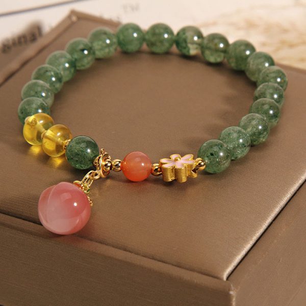 9b52fe552cdf93f6c5bf29018462b7a4.jpg green aventurine healing bracelet worn on wrist