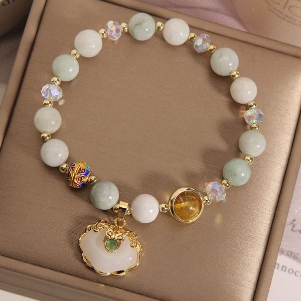 d0ecd7ff6eddc3334d7884f958c0eabe.jpg strawberry quartz love healing bracelet worn on wrist